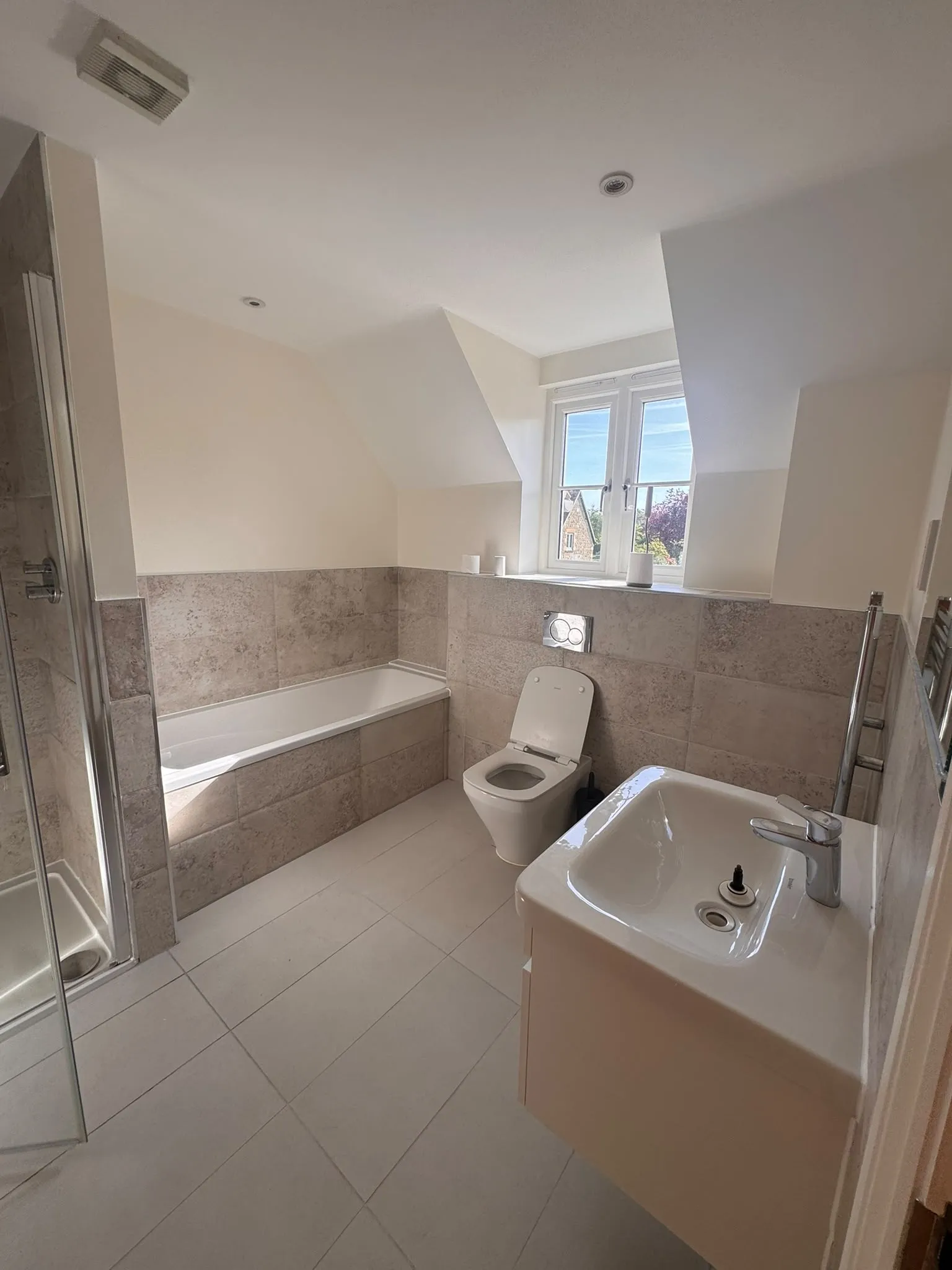 Bathroom with fresh paintwork above tiling