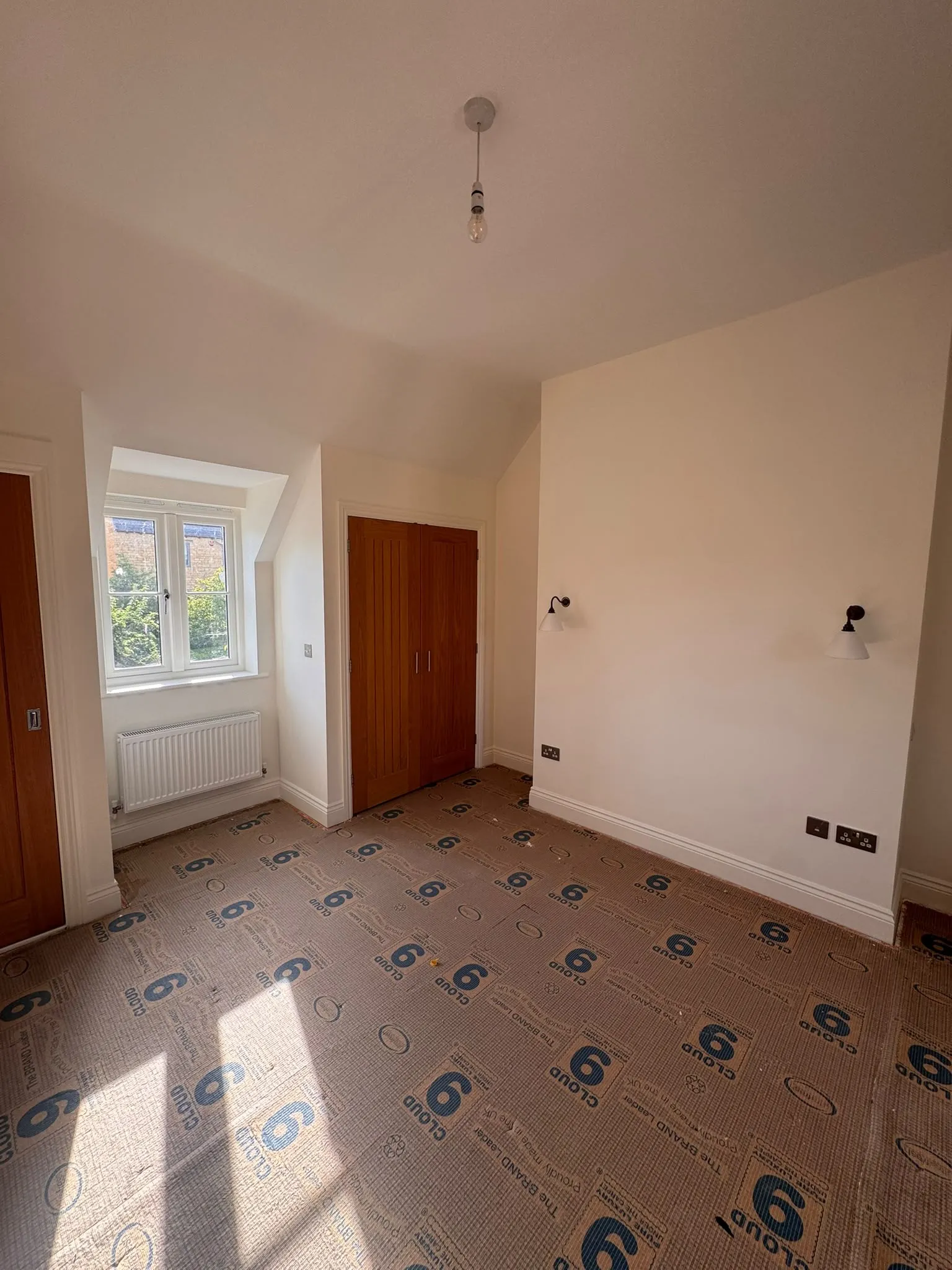 Bedroom with fresh white walls and painted doors