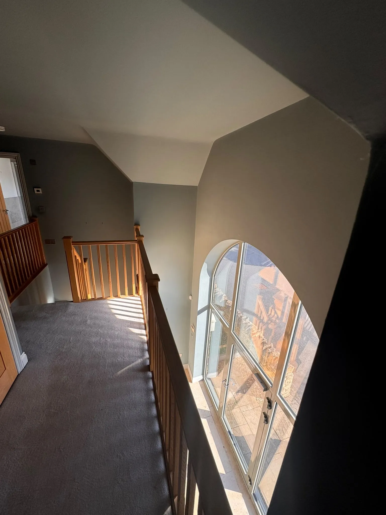 Landing with timber balustrade and painted walls